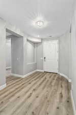 Spare room with light wood-type flooring