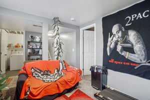 Bedroom featuring washer / clothes dryer