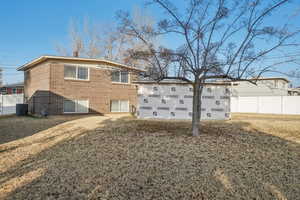 Front of house featuring newly enclosed car port/garage - siding to be finished with right offer