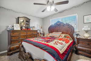 Bedroom with carpet and ceiling fan