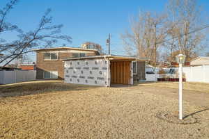 New solar panels. View of home's exterior featuring a carport