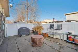 View of patio featuring area for grilling