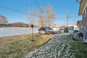 View of yard with a shed