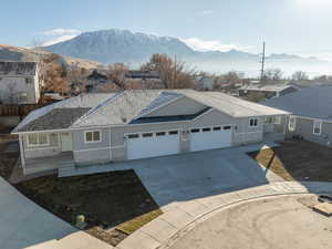 Single story home featuring a mountain view and a garage