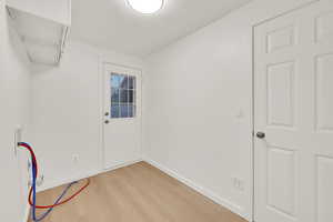 Doorway featuring light hardwood / wood-style floors