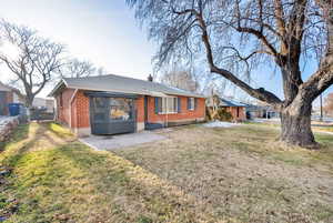 Exterior space with a yard and a patio area