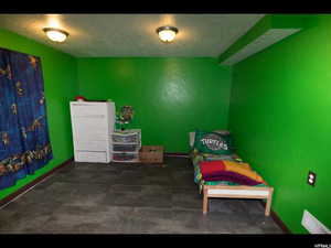 Bedroom featuring a textured ceiling