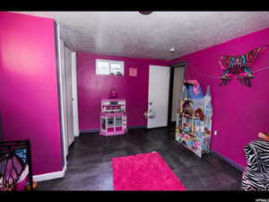 Playroom featuring a textured ceiling