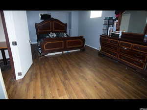 Bedroom featuring dark hardwood / wood-style flooring