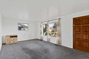 Empty room with carpet floors