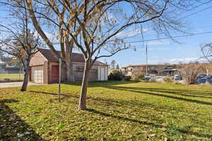 View of yard featuring a garage