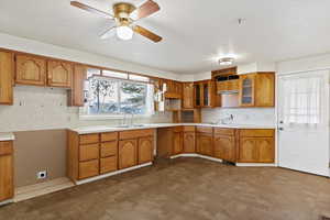 Kitchen with ceiling fan and sink