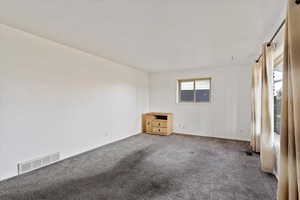 Empty room featuring carpet floors