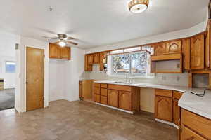 Kitchen with ceiling fan and sink