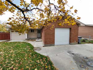 View of front facade featuring a garage