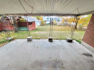 View of patio / terrace featuring a storage shed