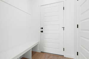 Mudroom with light hardwood / wood-style flooring