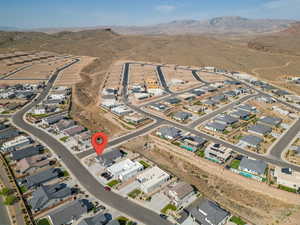 Birds eye view of property with a mountain view