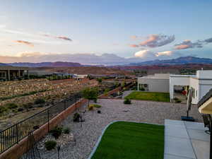 Yard at dusk with a mountain view