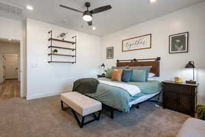 Bedroom featuring carpet and ceiling fan