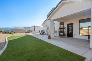 View of yard with a patio area and a mountain view