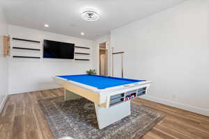 Rec room with hardwood / wood-style floors and billiards