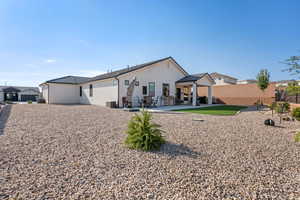 Rear view of house featuring a patio and central air condition unit