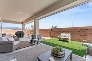 View of patio featuring a mountain view, area for grilling, and an outdoor hangout area