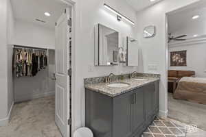 Bathroom featuring ceiling fan and vanity