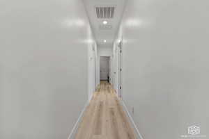 Hallway featuring light hardwood / wood-style flooring