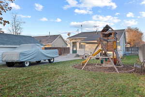 Exterior space featuring a patio and a playground