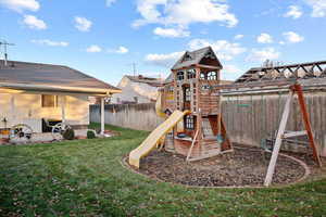 View of jungle gym with a yard