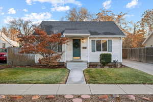 Bungalow-style house with a front yard