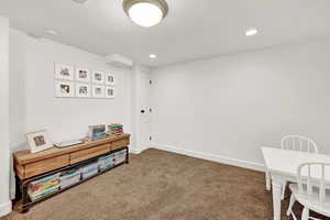 Interior space with a textured ceiling and carpet floors