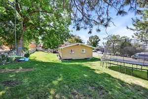 View of yard featuring a trampoline