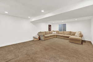 Unfurnished living room featuring carpet floors