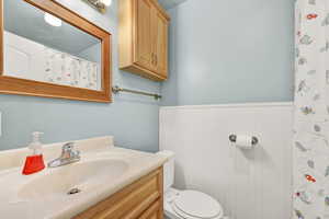 Bathroom featuring vanity and toilet