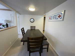 View of carpeted dining space