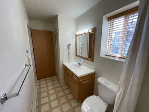 Bathroom with vanity and toilet