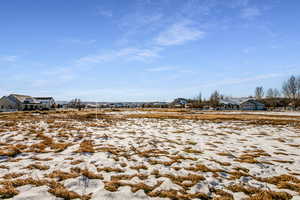 View of yard layered in snow