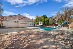 View of pool with a patio area, french doors, and a water slide