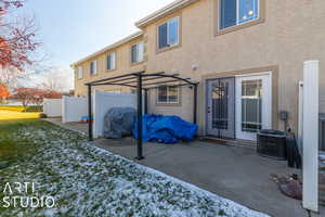 Back of house featuring a patio and central AC unit