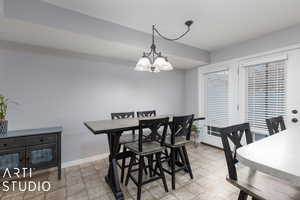 Dining space featuring an inviting chandelier