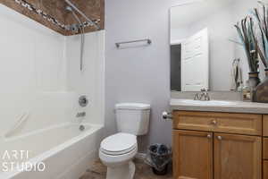 Full bathroom with vanity, toilet, and shower / washtub combination