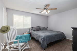 Bedroom featuring carpet flooring and ceiling fan