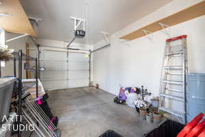 Garage featuring a garage door opener