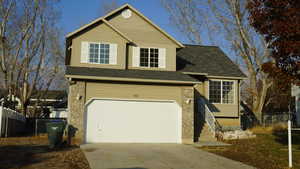 View of front of property with a garage