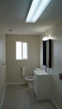 Bathroom with vanity and toilet