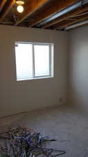 Empty room featuring concrete flooring and plenty of natural light