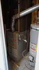 Utility room with gas water heater